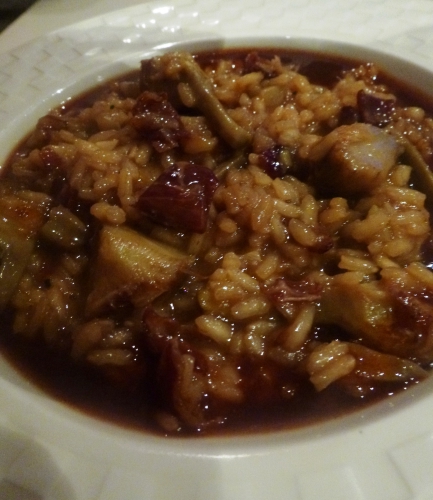 os et parures d'agneau,fond d'agneau,carottes,oignons,romarin,thym,laurier,persil,echalotes,ail,tomates,riz à risotto,arborio,carnarolli,vin blanc,bouillon de volaille,parmesan,beurre,vinaigre de vin rouge,citron,artichauts,poireau,céleri,jambon de bayonne,zeste d'orange,coriandre,barigoule,huile d'arachide