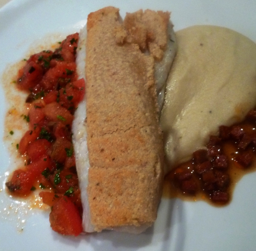 cocos de paimpol,bouillon de volaille,girofle,oignon blanc,poireau,céleri vert,crème,ail,romarin,noisettes,comté,panko,pignons,beurre,merlu,gros sel de guerande,thym; fleur de sel aux poivres du monde,jus de volaille,vinaigre de xères,chorizo,citron,tomates,persil,basilic,coriandre,olives noires,piment d'espelette,coriandre en poudre